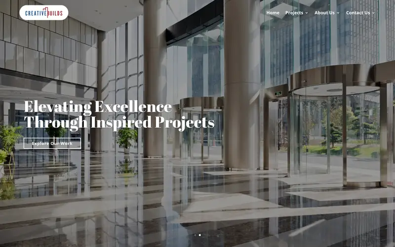 The Creative Builds homepage with a glass lobby and the headline Elevating Excellence Through Inspired Projects